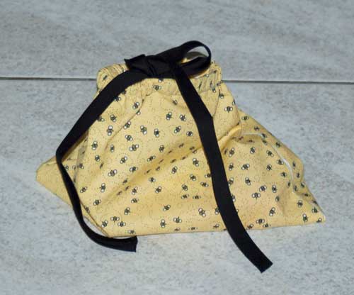 drawstring bag with buttonhole