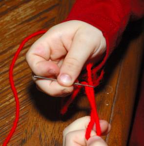threading a yarn needle