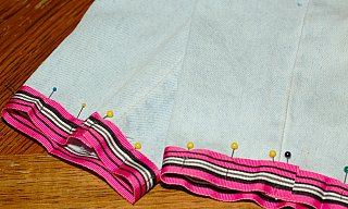 pin ribbon to bottom of pants