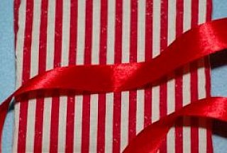sewing ribbon to bottle bag