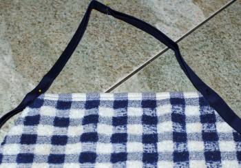 pin top of towel apron